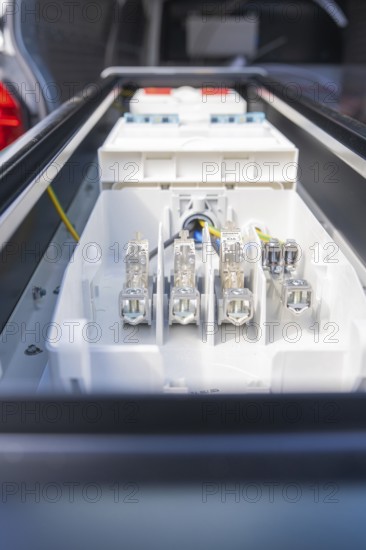 Close-up of electrical connections in a housing, assembly of a charging station for electric cars,