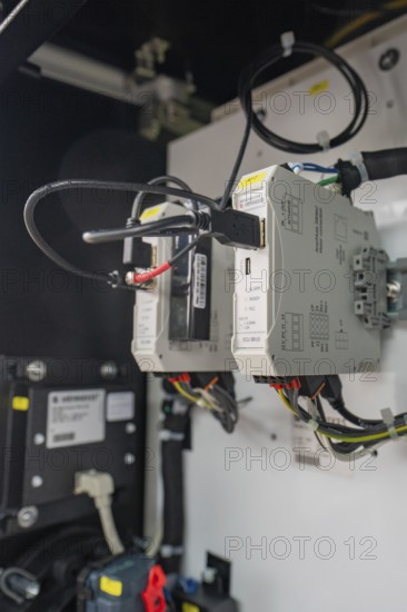 Internal wiring of a technical device inside a switch box, installation of a charging station for