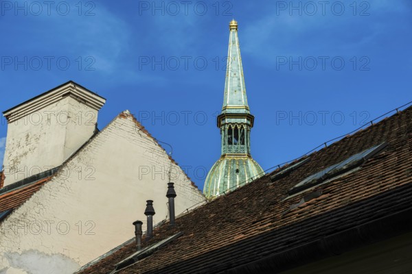 House roofs in the old town, in the background the tower of St Martin's Cathedral in Bratislava,
