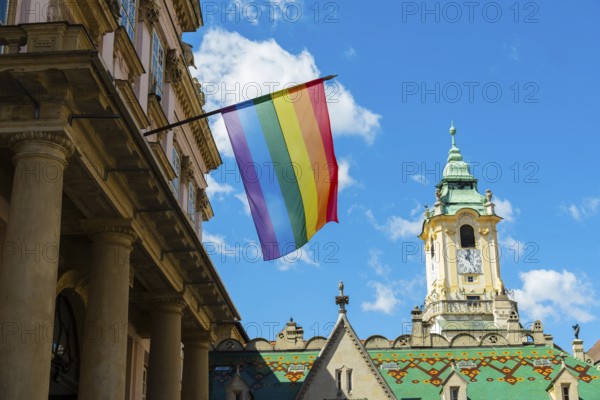 Rainbow flag on the Primatial Palace, in the background is the Old Town Hall of Bratislava,