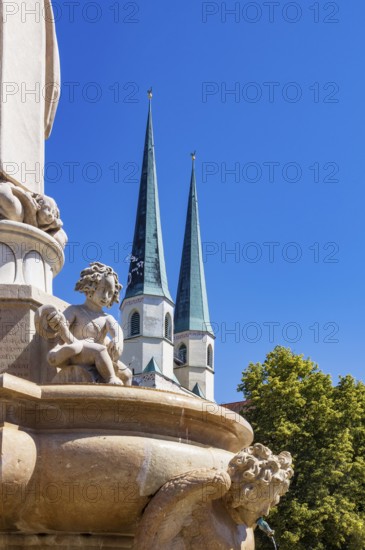 Marienbrunnen fountain on Kapellplatz with St.Philippus and Jakobus collegiate parish church, place