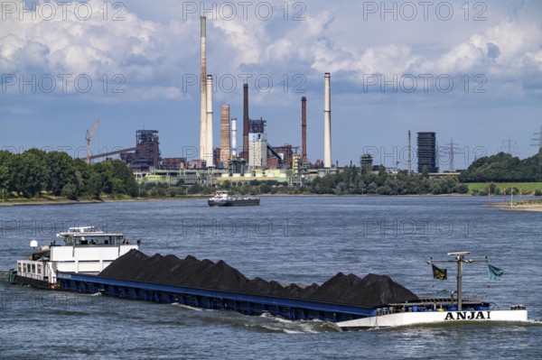 Industrial scenery of the ThyssenKrupp Steel steelworks in Duisburg-Bruckhausen, cargo ships on the