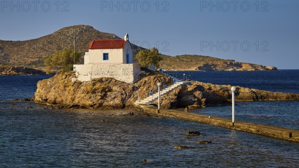 Chapel on rock in the warm morning light, surrounded by calm sea, Chapel, Church, Agios Isidoros,