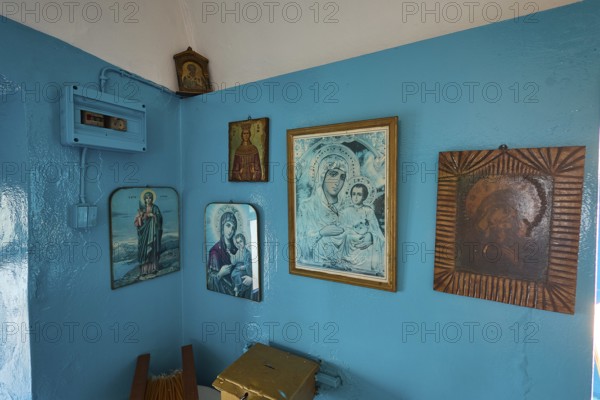 A room decorated with icons and blue-painted walls inside the church, chapel, church, Agios