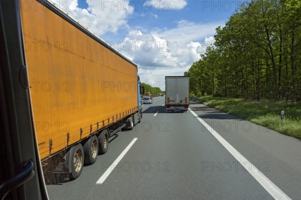 Overtaking manoeuvre by articulated lorry, lorry overtaken, A3 motorway near Nuremberg, Middle