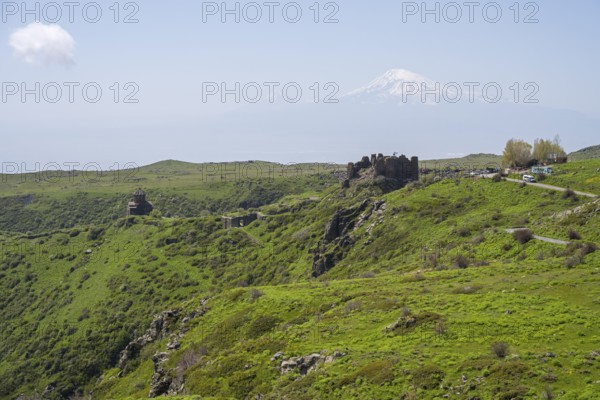 Ruins in green landscape with majestic mountain in background, Amberd Fortress and Mother of God