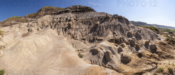 Panoramic view of unique hoodoo rock formations in drumheller, alberta, showcasing the geological