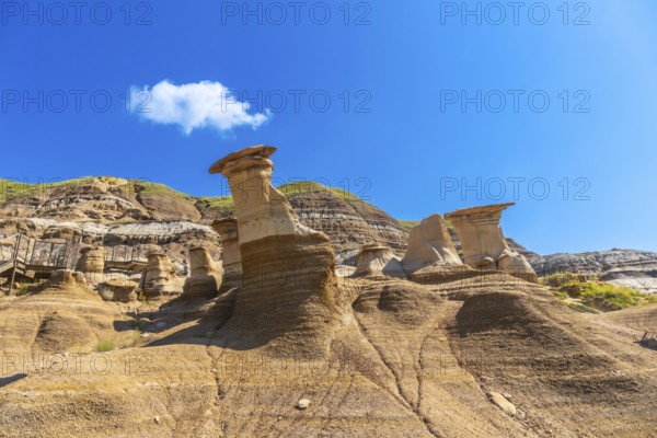 Breathtaking hoodoo rock formations dominate the arid landscape of drumheller, canada, under a