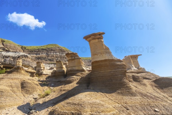 Breathtaking sandstone hoodoos rise majestically in drumheller valley, showcasing unique geological