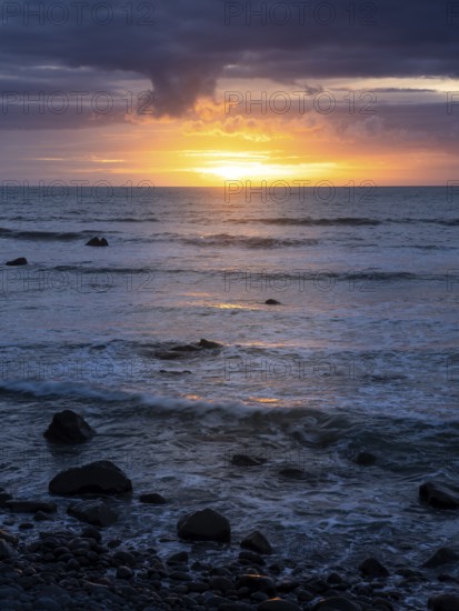 Sea in the evening at sunset, west coast of the Taranaki region, North Island, New Zealand