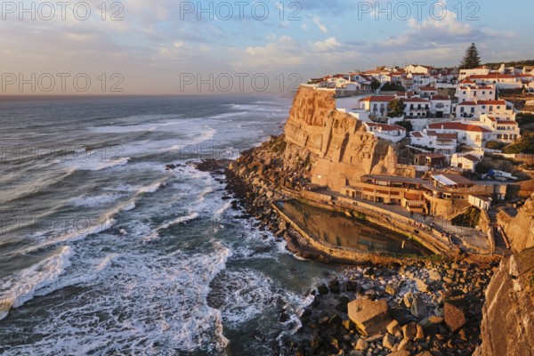Scenic view of the seaside Azenhas do Mar fishing village on cliff on Atlantic ocean coast,