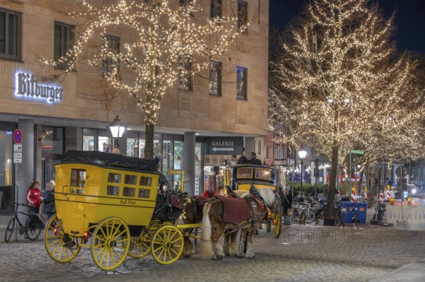Historic stagecoach rides with horseback during the Nuremberg Christmas Market, Nuremberg, Middle