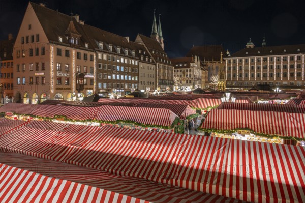 Nuremberg Christmas Market illuminated in the evening with the Beautiful Fountain, Town Hall and