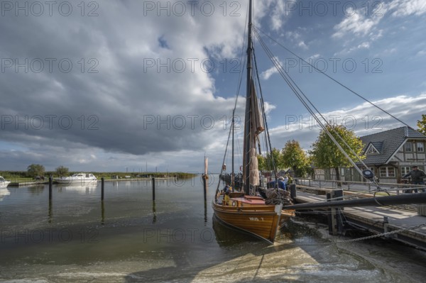 Historic sea boat, formerly used for sailing fishing, anchored in the port of Ahrenshoop,