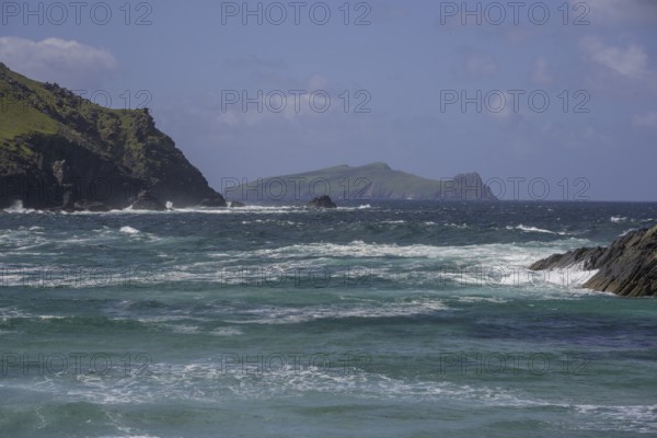 Waves crashing against cliffs in the background Inishtooskert Island (sleeping Giant), Clogher