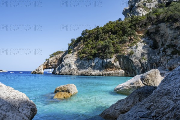 Light blue clear sea on a dream beach on Cala GoloritzÃ©, picturesque rocky coast, cliffs with rock
