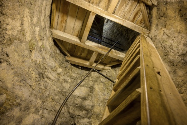 Climb over narrow wooden stairs in the round tower, St. Canice's Cathedral, Kilkenny, County