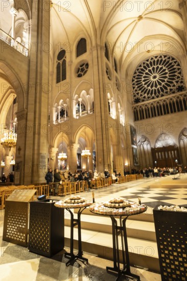 Notre dame cathedral interior in paris, france, displaying intricate gothic architecture, vaulted