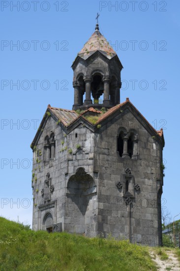 Single pointed stone turret on a hill against a blue sky, Haghpat Monastery, Haghpatavank, Haghpat