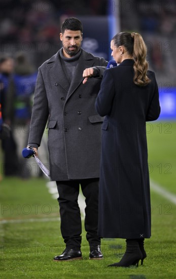 DAZN presenter Laura Wontorra and TV expert Sami Khedira with microphone, logo, gesture, thumbs
