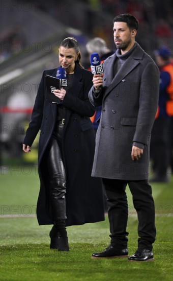 DAZN presenter Laura Wontorra in leather outfit and TV expert Sami Khedira with microphone, logo,
