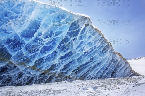 Glacier wall showing smooth melting blue ice made of compressed snow, Spitsbergen / Svalbard,
