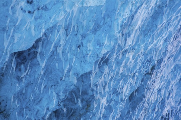 Close-up of compressed, smooth melting blue ice structure inside glacier, Spitsbergen / Svalbard,