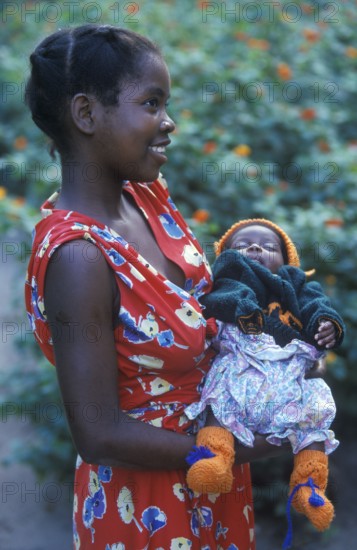 Portrait of a proud young mother with her newborn baby, Kande, Malawi, Africa, July 2000, vintage,