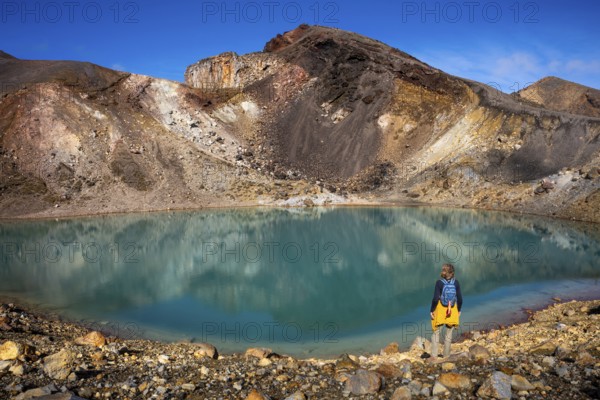 A hiker at one of the Emerald Lakes and Red Crater, Panorama, Tongariro alpine crossing, Tongariro