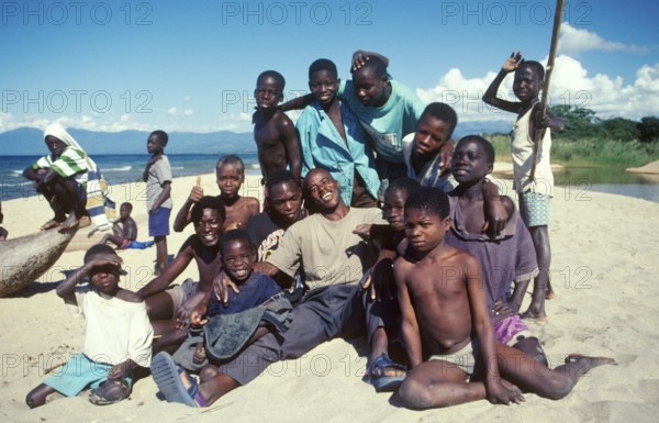 Boys and young men pose for a photo on Kande Beach on Lake Malawi, Malawi, Africa, July 2000,