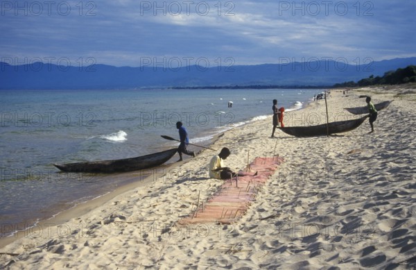 Dugout trees, fishermen at Kande Beach on Lake Malawi, Malawi, Africa, July 2000, vintage, retro,