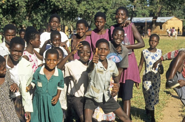 Happy children at a village festival in Kande, Malawi, Africa, July 2000, vintage, retro, old,