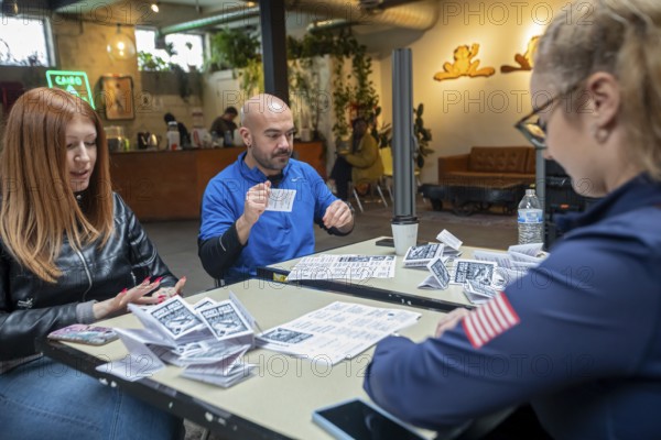 Detroit, Michigan - Volunteers with the Detroit Peoples Assembly put together whistle kits. The