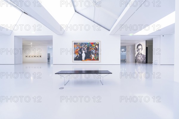 Bright, minimalistic gallery with large paintings and a bench in modern style, Open Horizons