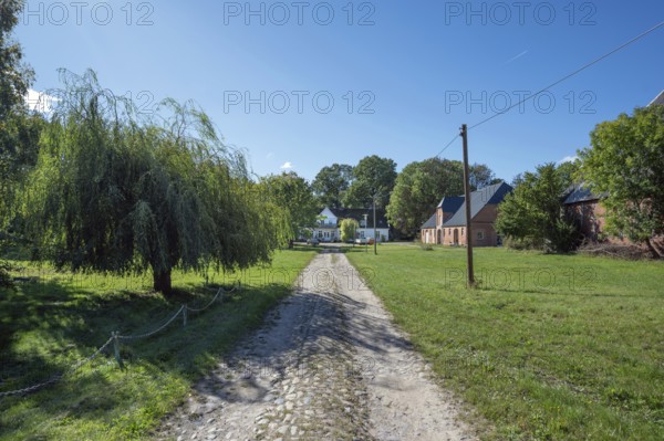 Old road to the old manor house, on the right the former horse stable from 1923, Gut Othenstorf,