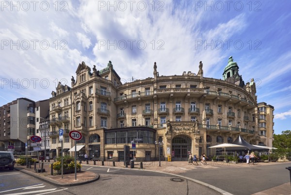 Historic building, former hotel palace hotel, barrier bollard, street, round faÃ§ade with windows,