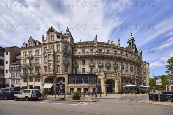 Historic building, former hotel palace hotel, barrier bollard, street, round faÃ§ade with windows,