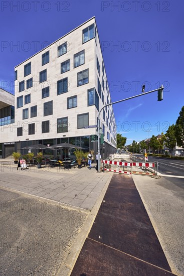 Commercial building, modern architecture, outdoor area of a restaurant, waffle house, fenced