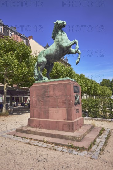 Orange monument, horse sculpture, trees, general architecture, blue sky, cirrus clouds,