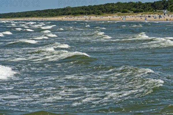 Play of Baltic Sea waves on the beach of the seaside resort of Ahlbeck, Usedom island,