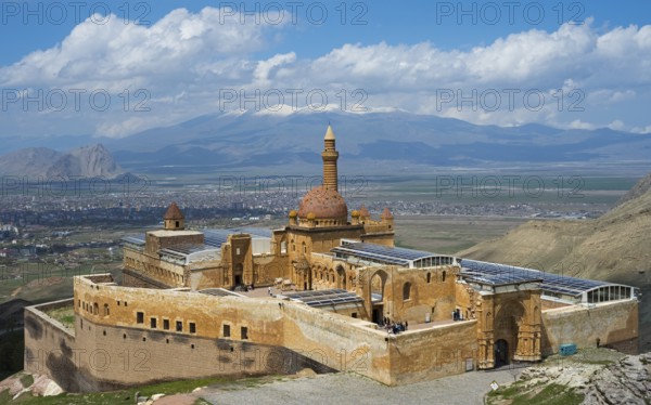 An old castle surrounded by mountains and a vast valley under a clear sky, Ishak Pasha Palace,