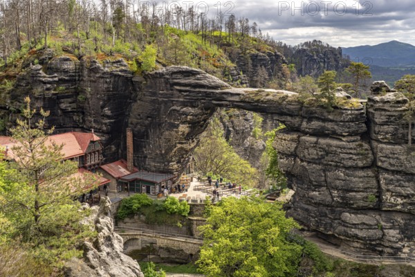 The Prebischtor rock arch and the Hotel Falkennest or SokolÃ­ hnÃ­zdo in the Bohemian Switzerland