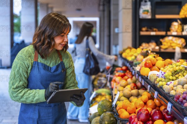 Woman in an apron and gloves managing inventory, checking stock levels of fresh fruit and produce