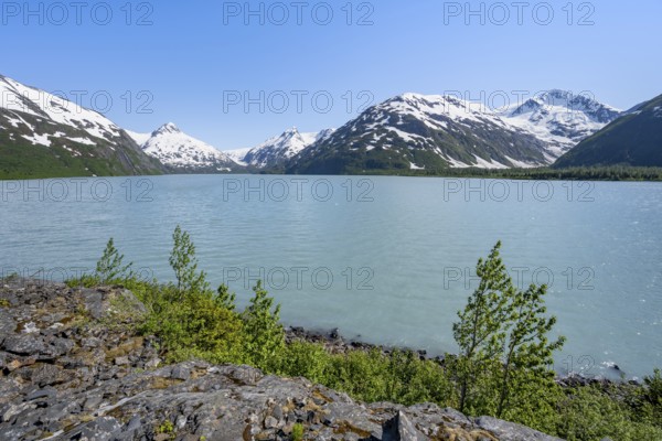 View of mountains with Portage Glacier glacier and turquoise glacial lake Portage Lake, Chugach