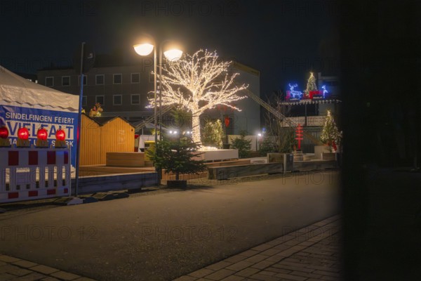 Atmospheric Christmas market at night with illuminated trees and stands, Sindelfingen, Böblingen