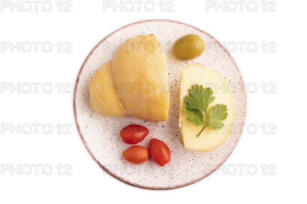Smoked Mozzarella cheese, with tomatoes and olives isolated on white background, top view, flat