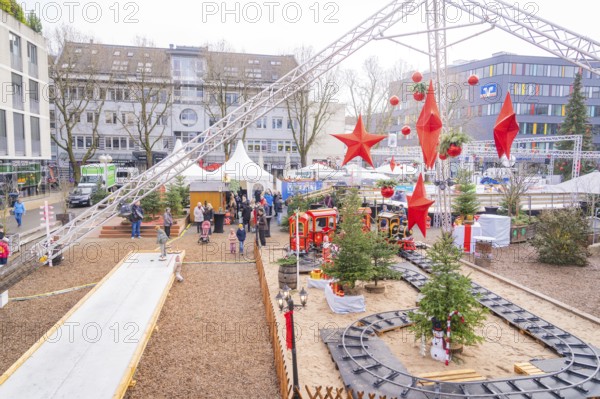 Christmas market with decorations and a toy train surrounded by visitors, Sindelfingen, Böblingen
