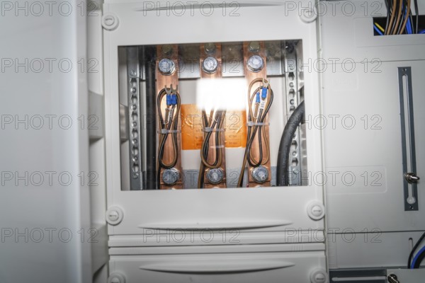 Close-up of a control box with detailed wiring and copper elements, electrician, new building,