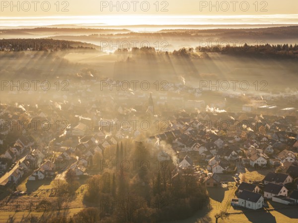 View of a village from above, rays of light and fog create an atmospheric atmosphere, Gechingen,