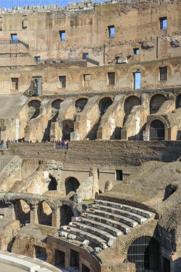 Restored historic grandstand seating marble seats near east entrance to the Colosseum, Rome,